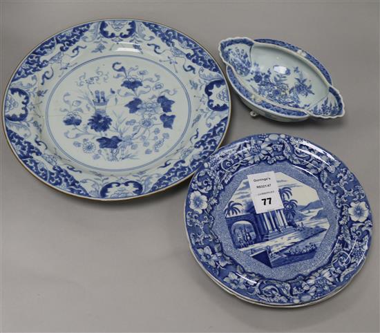 An 18th century Chinese blue and white dish and sauceboat, dish diameter 35cm (both a.f.)